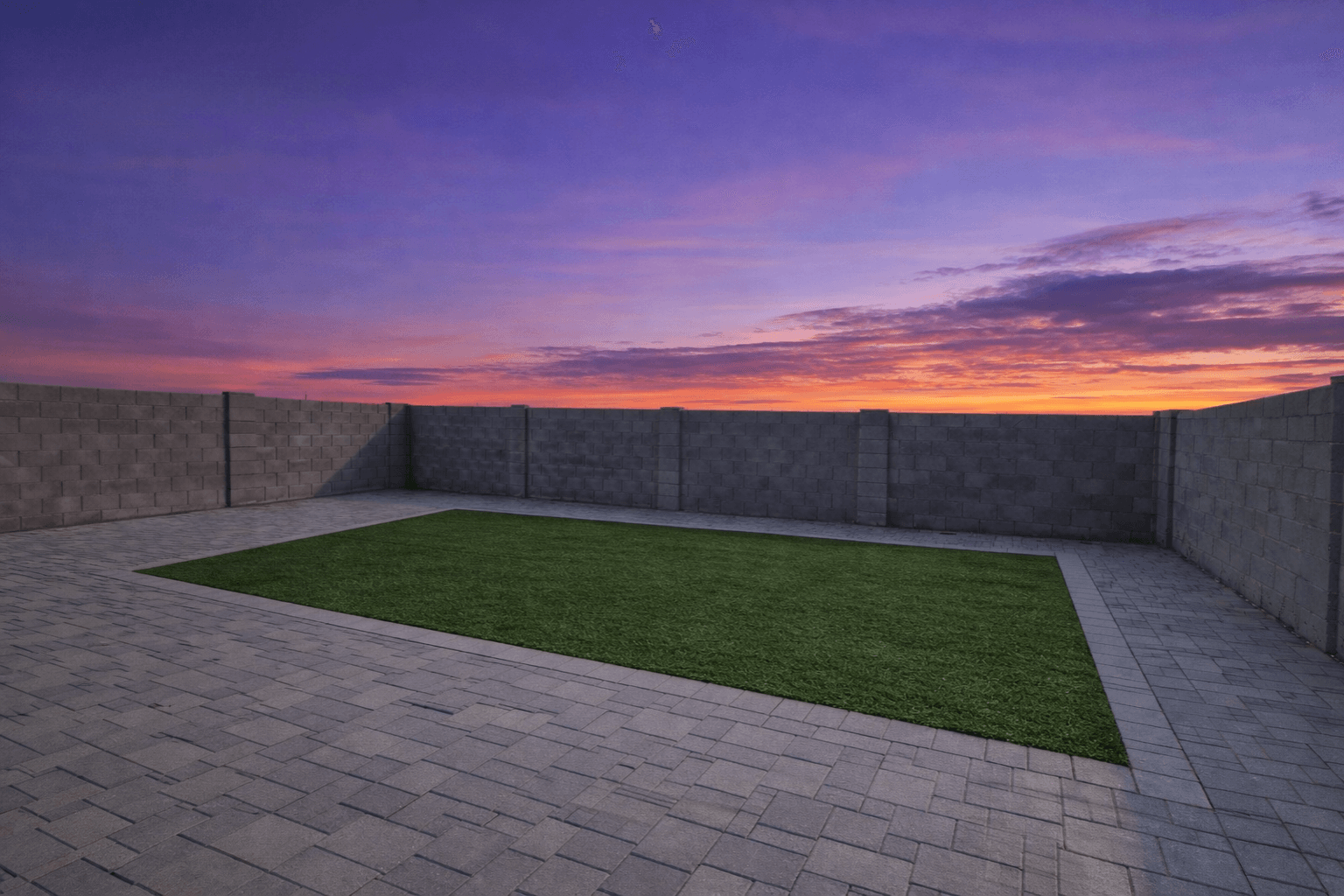 Completed backyard with turf, pavers, and pergola — Chandler AZ