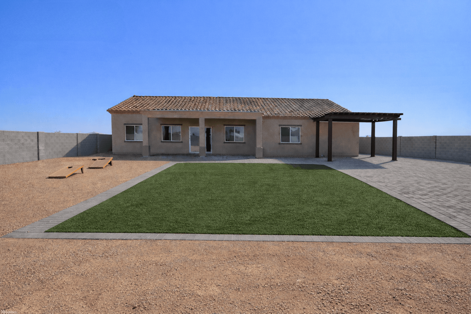 Completed backyard with artificial turf and pavers — Arizona