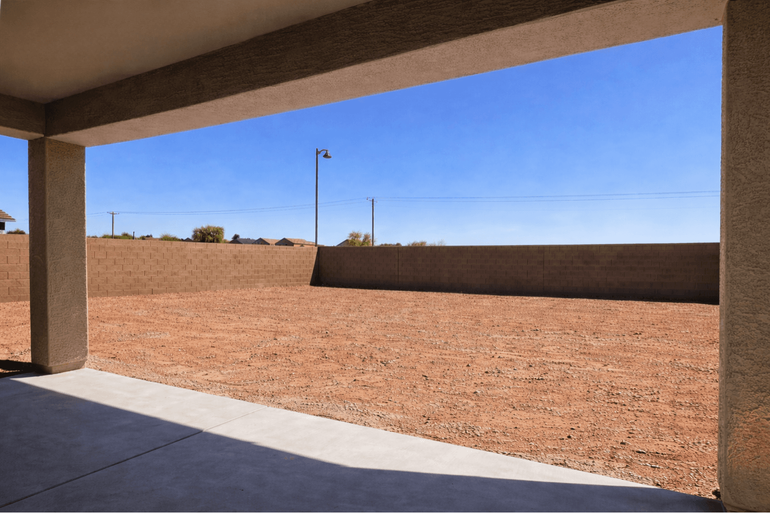Empty walled lot before installation — Arizona