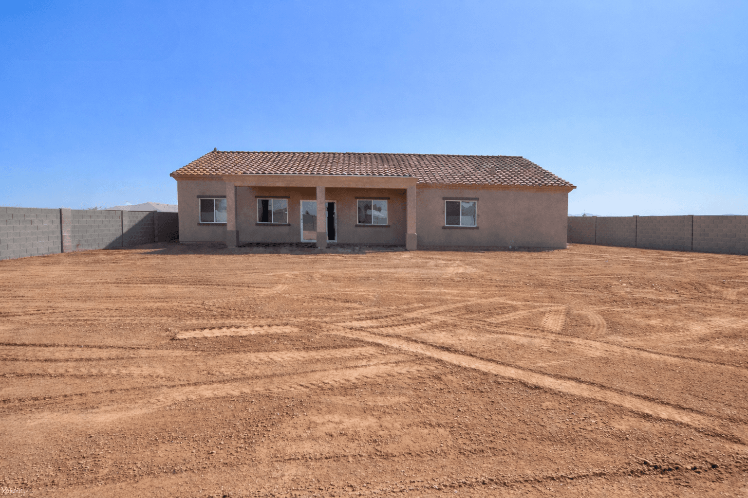 Backyard before artificial turf and paver installation — Arizona