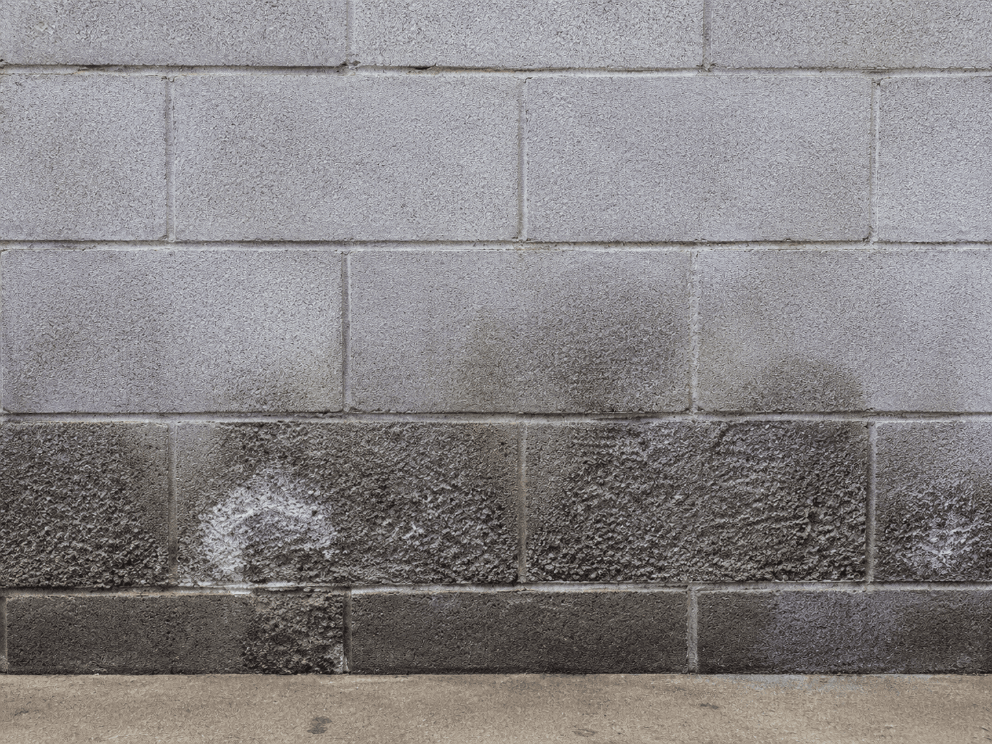 Crumbling or spalling block faces — block wall damage example