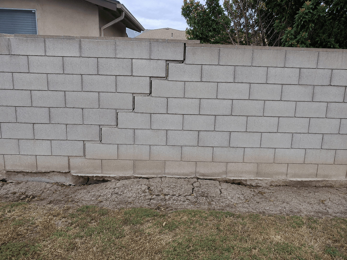 Footing movement or heave — block wall damage example